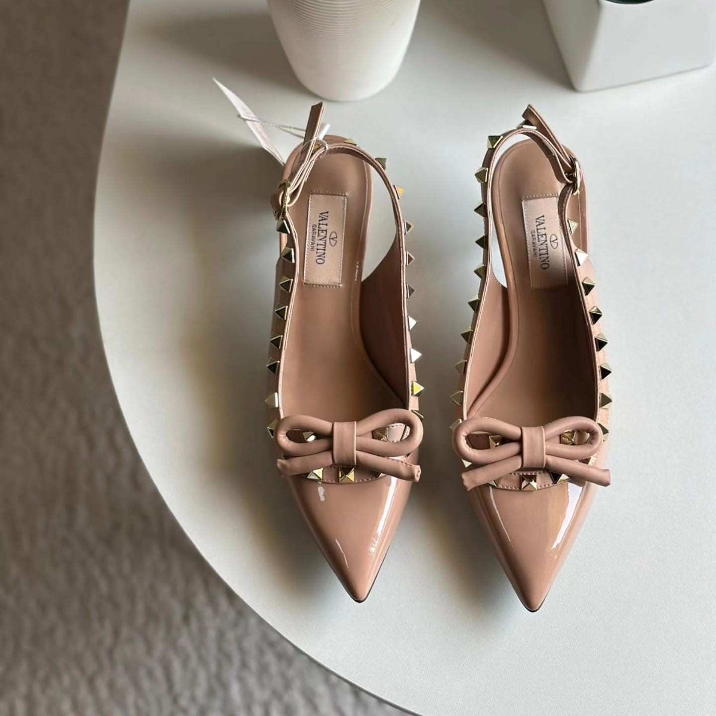 Valentino Garavani Rockstud bow slingback pumps