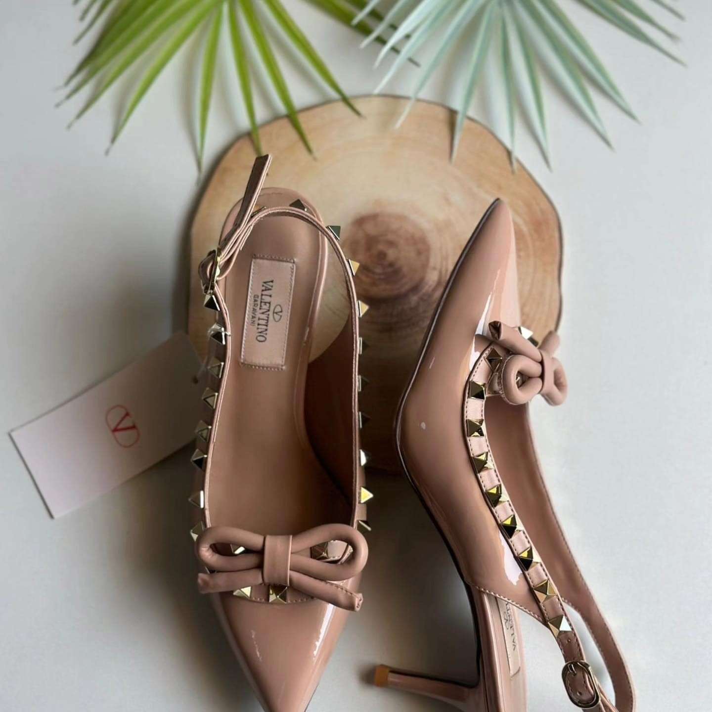 Valentino Garavani Rockstud bow slingback pumps