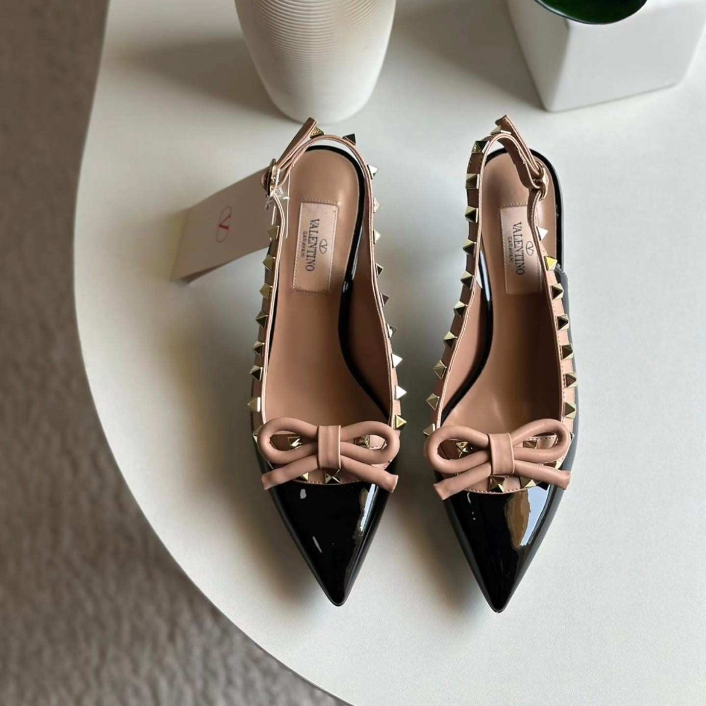 Valentino Garavani Rockstud bow slingback pumps